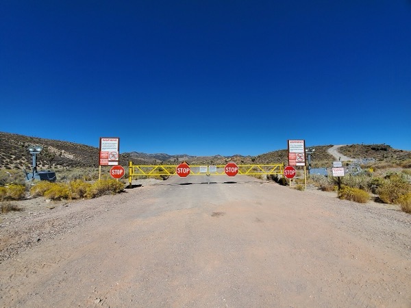 Main gate of Area 51 with restricted access warning signs